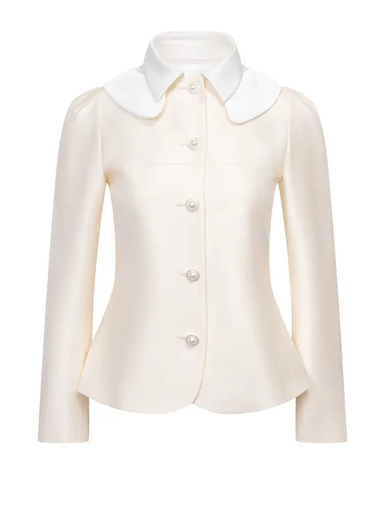 RECIT Long-sleeve jacket paired with a multi-layered puffy mini skirt ...
